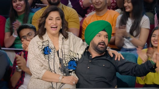 Archana Puran Singh sits in Kapil's lap. Archana Puran Singh sits in Kapil's lap.