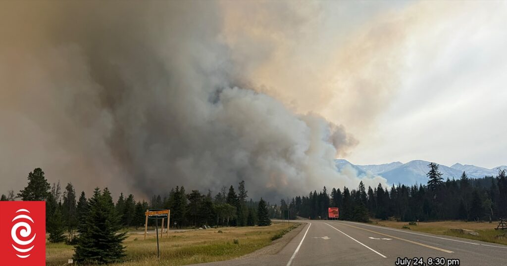 Blaze in Canadian tourist town still out of control but rain helping firefighters