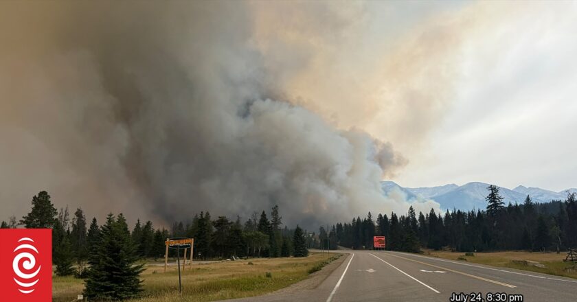 Blaze in Canadian tourist town still out of control but rain helping firefighters