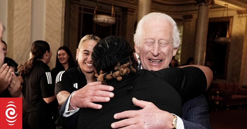 Smiling King Charles accepts ‘healing’ group hug from Black Ferns