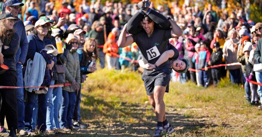 Mud, beer and cash: Annual wife-carrying championship takes Maine by storm | US News