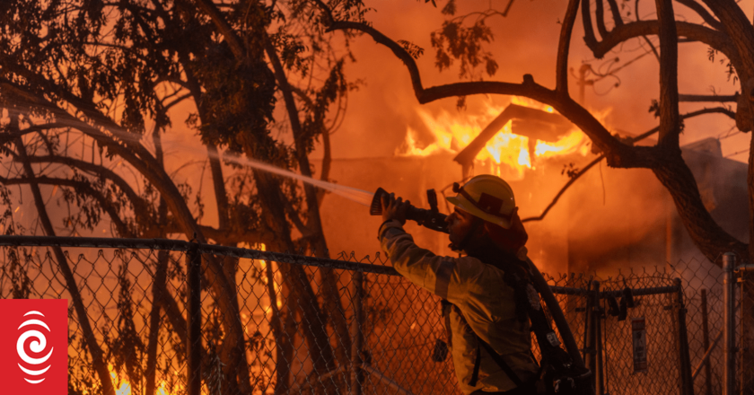 Thousands under evacuation near Los Angeles as wildfire torches homes