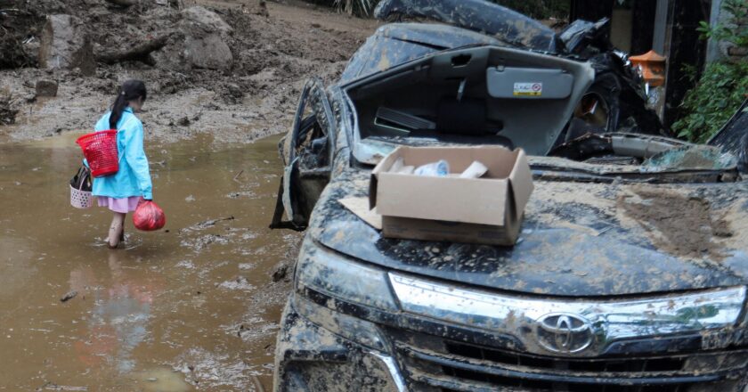 Indonesia landslides and flash floods kill at least 27 – with rescuers searching for vehicles trapped in mud | World News
