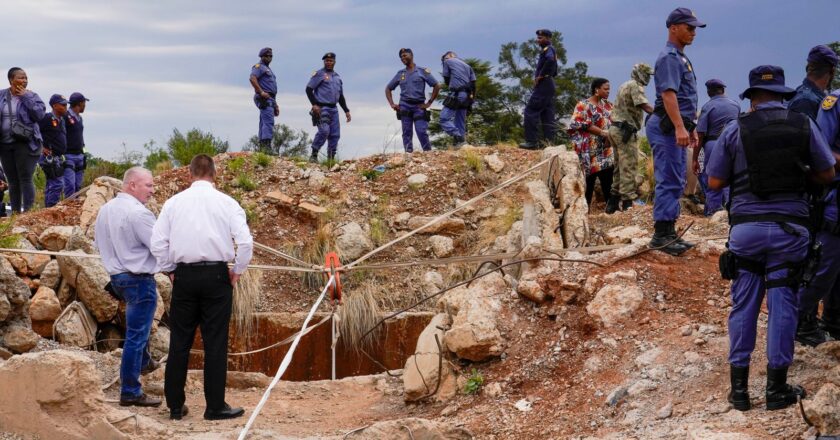South African minister holds out olive branch to illegal miners in stand-off with police | World News
