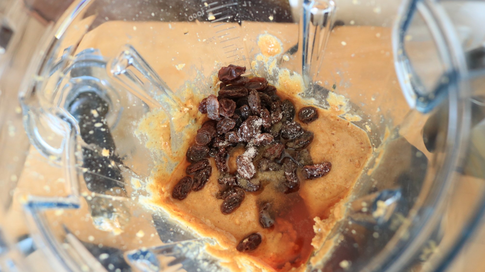 How to Make Peanut Butter in the Vitamix Ascent X5 6 Walnut butter with rum and raisins in a blender container.