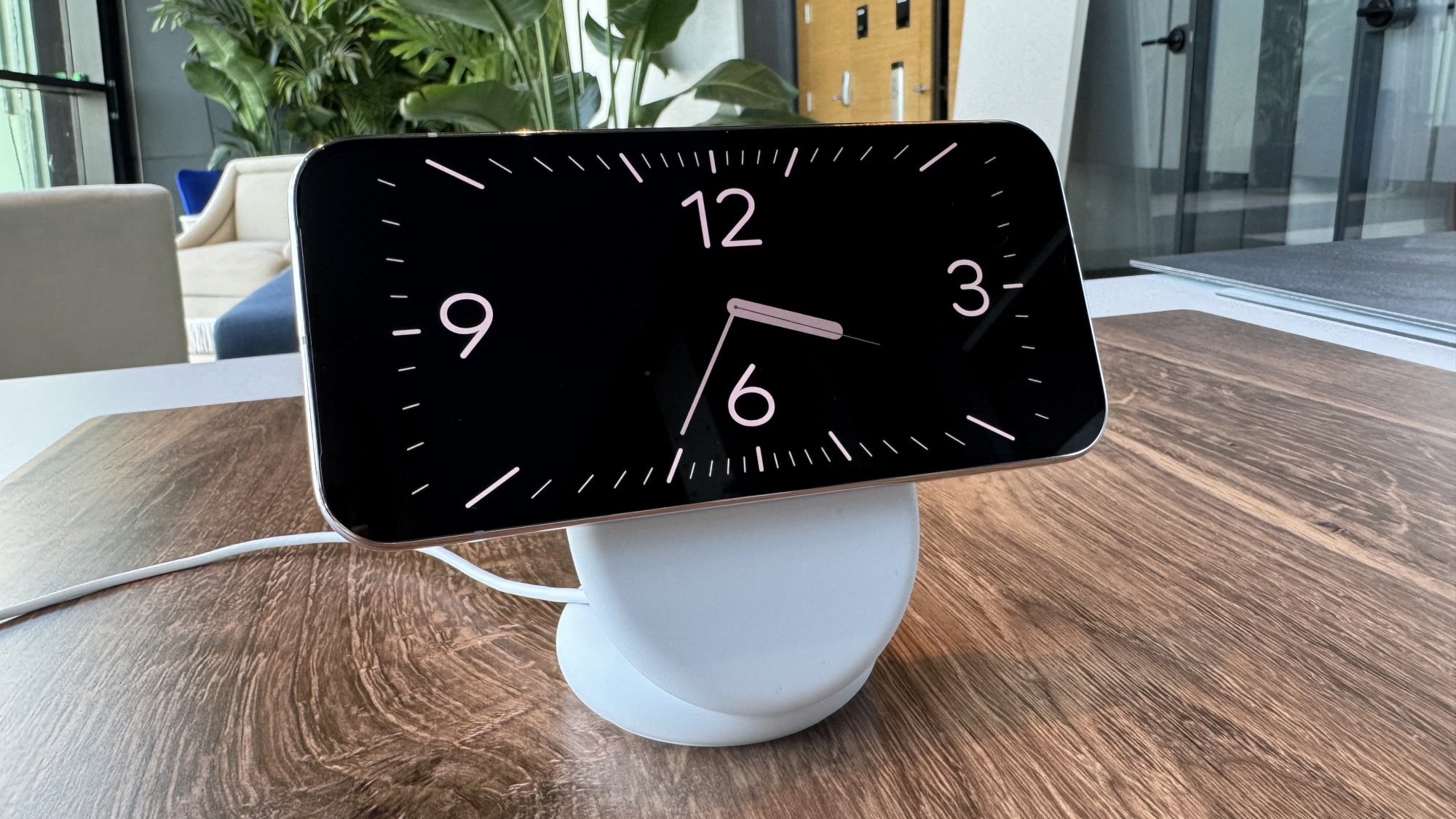 The Pixel 10 resting on a Pixelsnap Carger with Stand